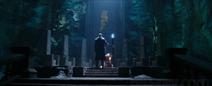 Shazam 2: Fury of the Gods dim cavern set with a lone figure at the top of stone steps